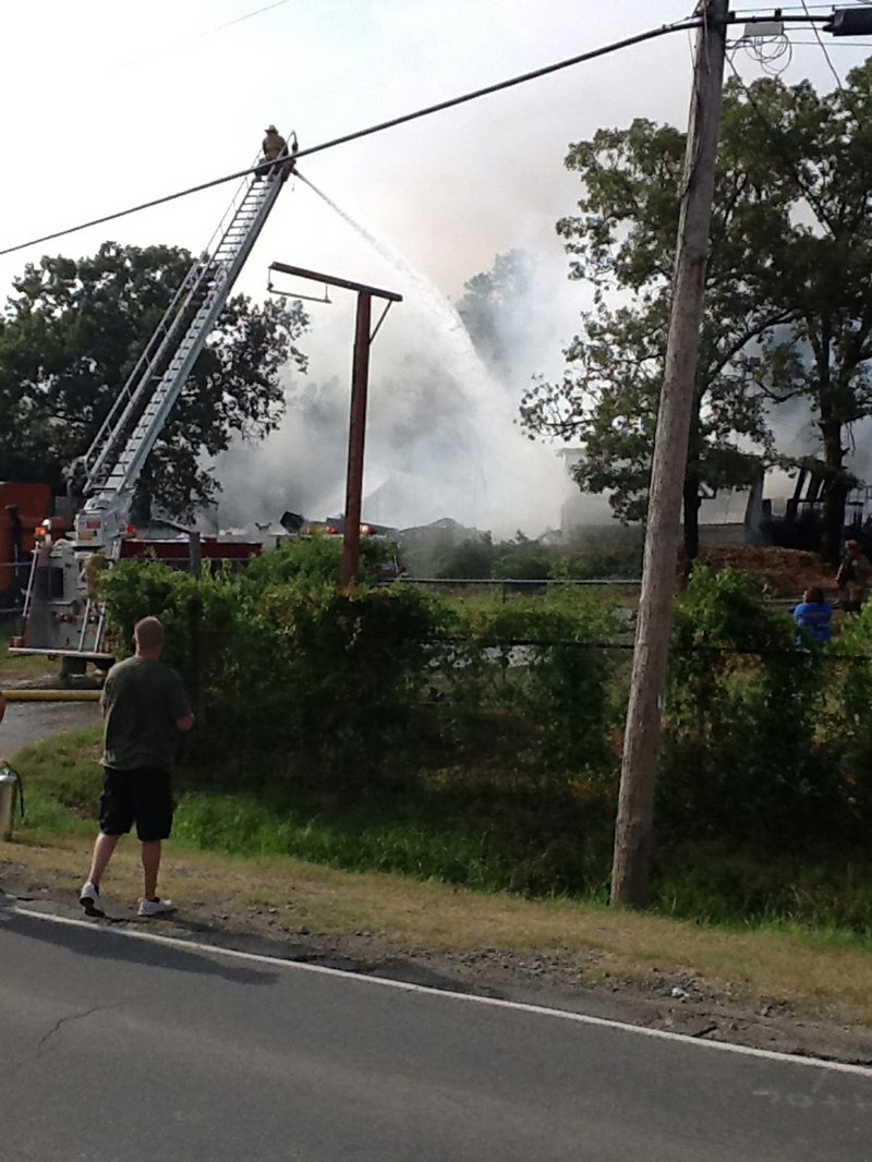 Crews respond to a blaze at a fireworks warehouse in North Little Rock Tuesday afternoon.