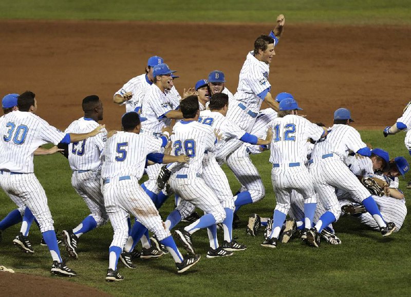 UCLA players celebrate Tuesday night after defeating Mississippi State 8-0 in Game 2 of the College World Series championship in Omaha, Neb., giving the Bruins their first national championship in baseball. 