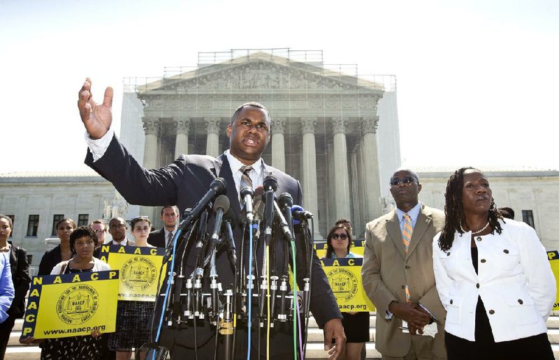 Ryan Haygood, director of the NAACP Legal Defense Fund, attacks the Supreme Court ruling Tuesday outside the court, which NAACP official Sherrilyn Ifill said “takes the most powerful tool our nation has had to defend minority voting rights out of commission.” 