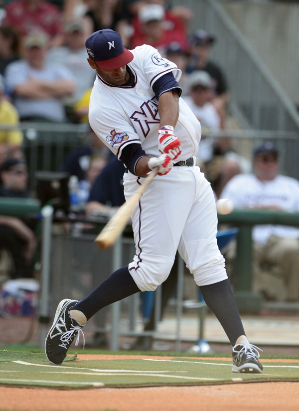 Northwest Arkansas Naturals first baseman Matt Fields connects on one of his 23 home runs in the Texas League All-Star Game home run derby Tuesday at Arvest Ballpark in Springdale. 