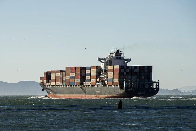 A container ship leaves San Francisco Bay on June 20. U.S. exports slowed in the first quarter, the Commerce Department said Wednesday. 