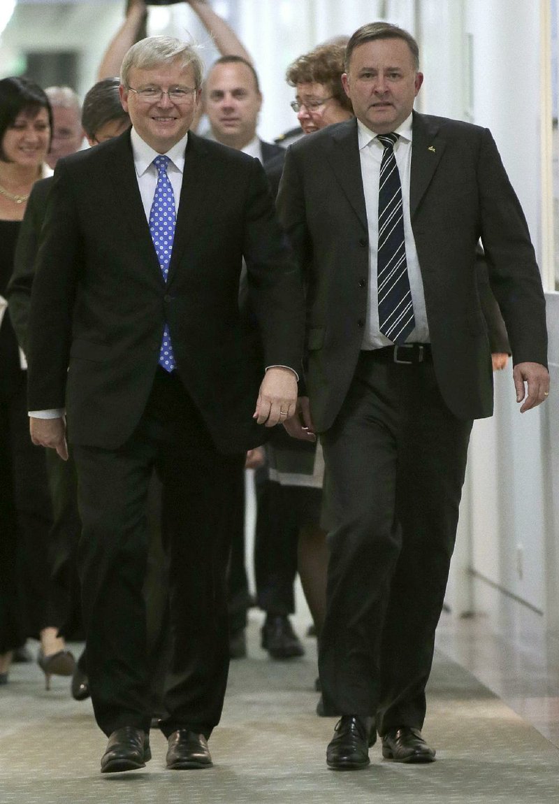 Kevin Rudd, (left) Australia’s former premier, walks with politician Anthony Albanese on Wednesday after a Labor Party leadership ballot in Canberra that ousted Prime Minister Julia Gillard as head of the party. 