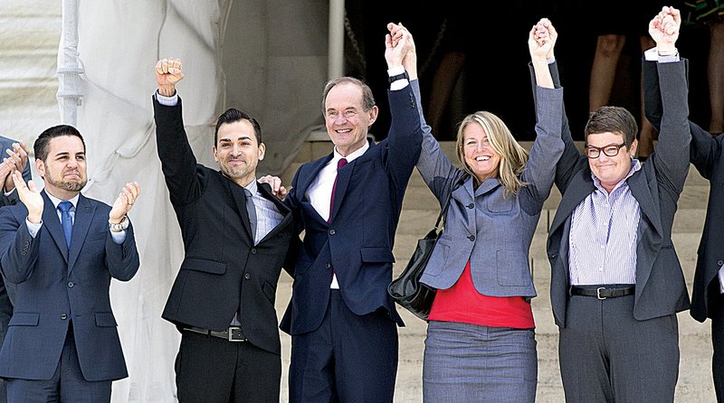 The plaintiffs in the California gay-marriage case celebrate Wednesday on the steps of the U.S. Supreme Court building. From left are Jeff Zarrillo and his domestic partner, Paul Katami, attorney David Boies, and Sandy Stier and her domestic partner, Kris Perry. 