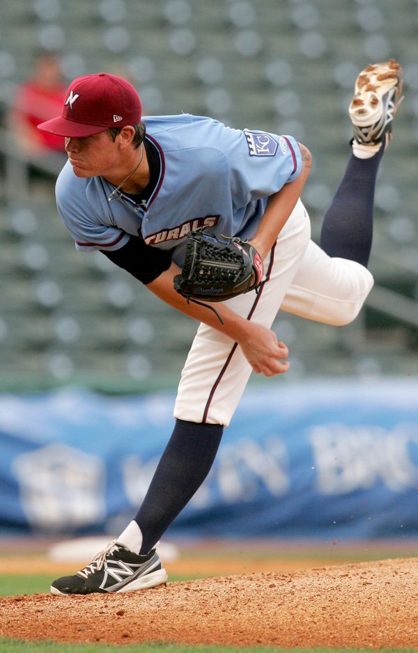 Aaron Brooks of the Northwest Arkansas Naturals delivers a pitch Wednesday night against the Midland RockHounds in Springdale. 