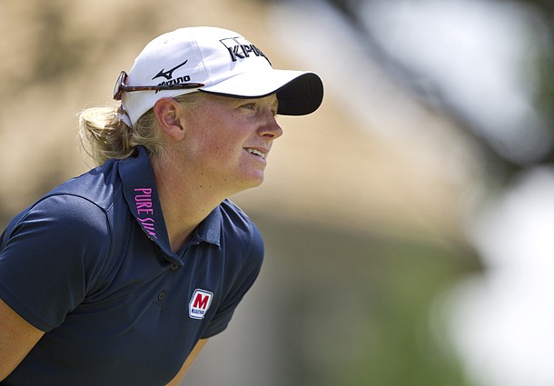 Stacy Lewis watches her ball from the third tee box during the final round of the LPGA NW Arkansas Championship golf tournament on Sunday, June 23, 2013, in Rogers, Ark. (AP Photo/Beth Hall)