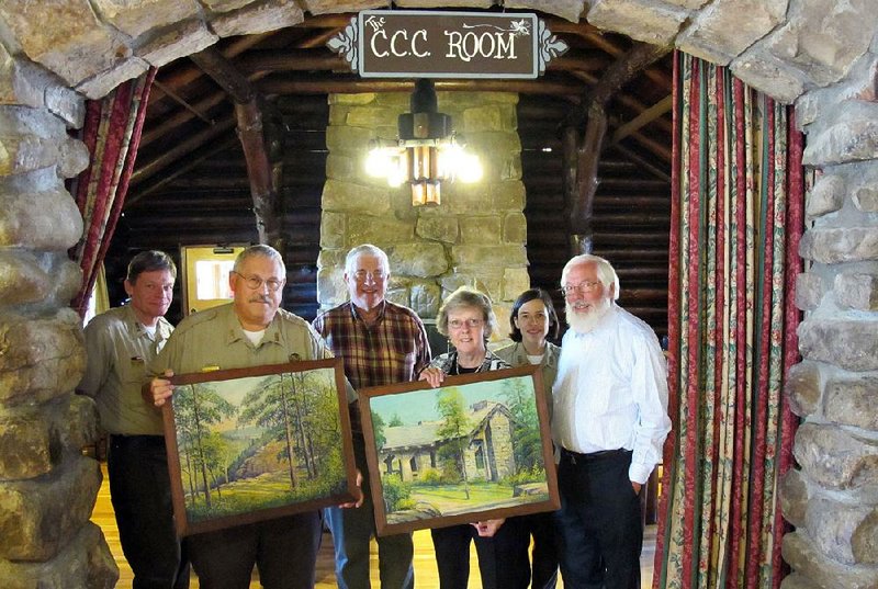 A pair of paintings created in 1937 were discovered in Oregon, returned and recently displayed in Mather Lodge at Petit Jean State Park. Those attending the return of the paintings included (from left) park interpreter B.T. Jones, park Superintendent Wally Scherrey, Arkansas Department of Parks and Tourism Executive Director Richard Davies, Civilian Conservation Corps artist researcher and author Kathleen Duxbury of Ridgewood, N.J., park interpreter Rachel Engebrecht and Duxbury’s husband, Gardner Yeaw. 
