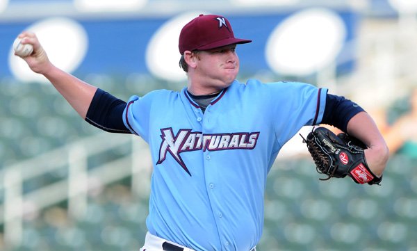 Brooks Pounders of the Northwest Arkansas Naturals pitches during the first inning Thursday against the Midland RockHounds at Arvest Ballpark in Springdale.