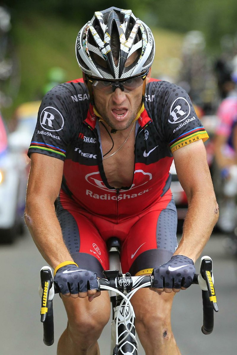 Lance Armstrong of the US rides towards Pau during the 16th stage of the Tour de France cycling race over 199.5 kilometers (124 miles) with start in Bagneres-de-Luchon and finish in Pau, Pyrenees region, France, Tuesday, July 20, 2010. (AP Photo/Bas Czerwinski)