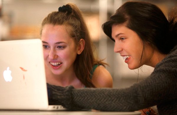 Heather Jenkins, 16, left, and Crystal Dean, 18, work together on a line of organic body products Tuesday afternoon as they participate in the 2013 Entrepreneur Boot Camp. The camp is open to high school students and gives them a look at running their own business in a weeklong event featuring speakers, workshops, tours dealing with entrepreneurship and ends with a 60-second elevator pitch contest.