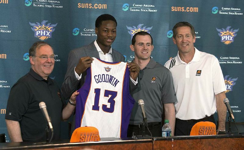 Archie Goodwin (second from left) was introduced by the Phoenix Suns on Friday by President of Basketball Operations Lon Babby (left), General Manager Ryan McDonough and Coach Jeff Hornacek. Goodwin played at Sylvan Hills before spending one season at Kentucky. 