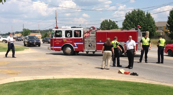 Fayetteville police work the scene of a hit-and-run accident Monday where a pedestrian was injured. 