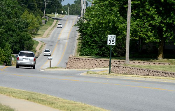 A proposed realignment of Don Tyson Parkway between Carley Road and 40th Street would take out the retaining wall on the north side between Ray Lane and Hamm Lane to improve sight lines. The realignment also could take out Ray Dotson’s home. 