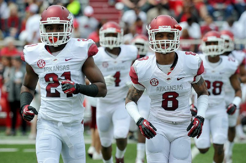 NWA Media/MICHAEL WOODS  --04/20/2013--   University of Arkansas cornerback Carroll Washington (21) and Tevin  Mitchel (8) during Saturdays Red White scrimmage at Razorback Stadium in Fayetteville.