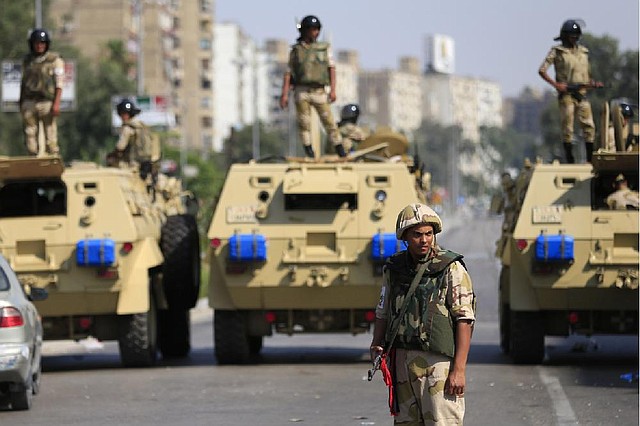 Egyptian soldiers secure the area around Nasser City in Cairo where Muslim Brotherhood supporters gathered Thursday to support ousted President Mohammed Morsi. 