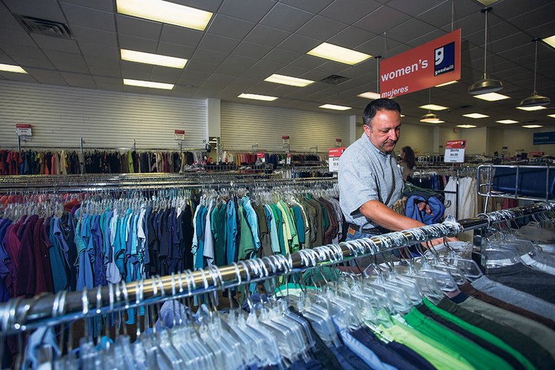 Danny Gibson of Newport browses through shirts at the Searcy Goodwill’s temporary location. In March, the Goodwill store’s previous location burned, but Chili’s, through receipt donations, has contributed to funds to help get a new store built.