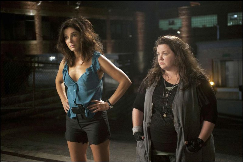 Sandra Bullock (left) and Melissa McCarthy star as ill-matched partners FBI Special Agent Sarah Ashburn and Boston detective Shannon Mullins in The Heat. The film came in second at last weekend’s box office and made $39 million. 