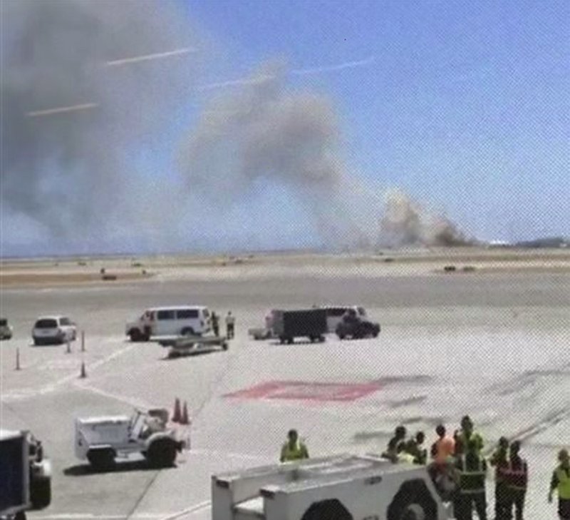 This photo provided by Wei Yeh shows what a federal aviation official says was an Asiana Airlines flight crashing while landing at San Francisco airport on Saturday, July 6, 2013. It was not immediately known whether there were any injuries.