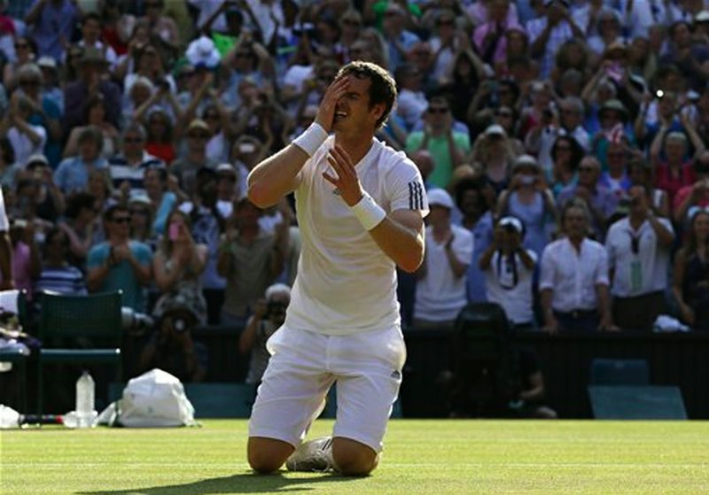 Andy Murray of Britain reacts after winning against Novak Djokovic of Serbia in the men's singles final match at the All England Lawn Tennis Championships in Wimbledon, London, Sunday, July 7, 2013.