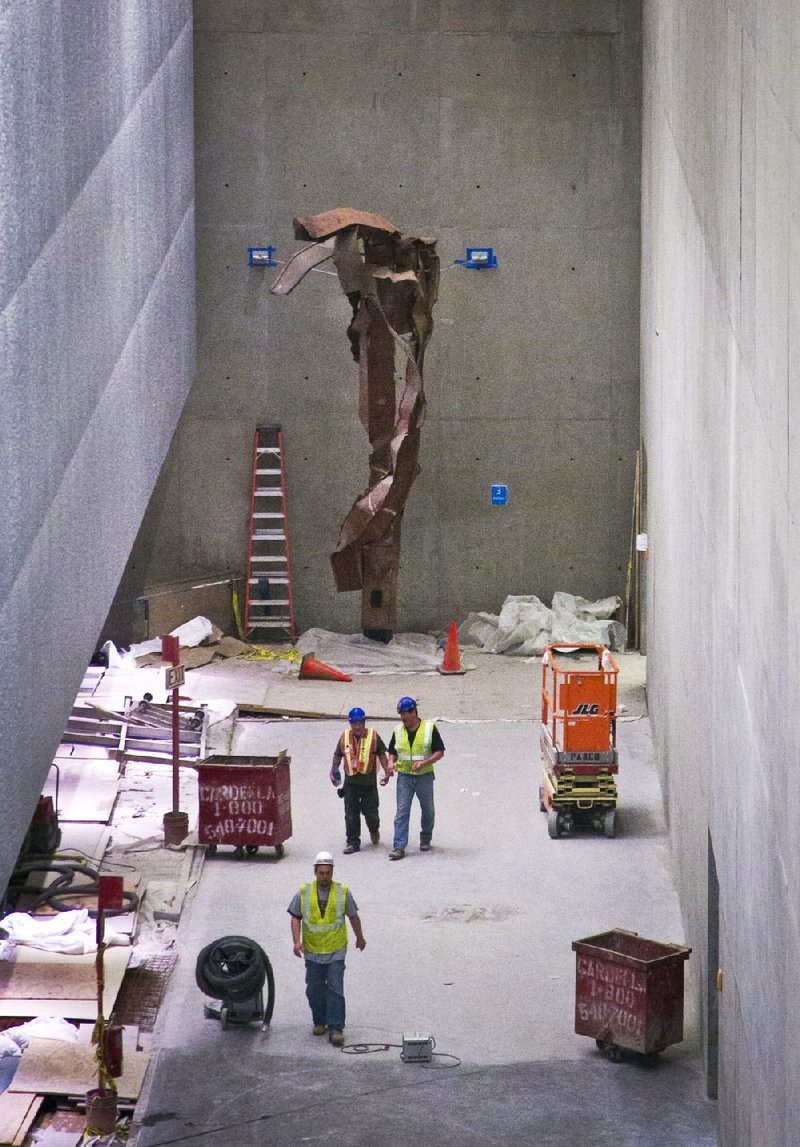 A twisted steel column from the World Trade Center site is shown in its permanent location at the 9/11 Memorial Museum. Recovered from the site after Sept. 11, 2001, this column once stood in the core of the South Tower. 