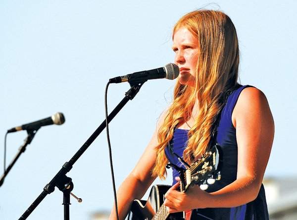 Sarah Smith, 12, of Rogers performs “Mama’s Broken Heart” by Miranda Lambert for a talent show June 21 at 3rd Friday in downtown Rogers. The July event will take place from 5 to 9 p.m. this Friday. Nathan Aronowitz will perform this month.
