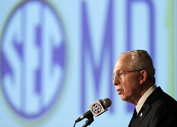 Southeastern Conference Commissioner Mike Slive talks with reporters during the SEC football Media Days in Hoover, Ala., Tuesday, July 16, 2013. (AP Photo/Dave Martin)