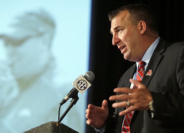 Arkansas coach Bret Bielema talks with reporters during the Southeastern Conference football Media Days in Hoover, Ala., Wednesday, July 17, 2013. (AP Photo/Dave Martin)