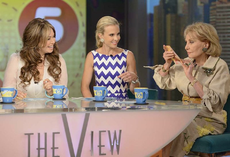 Elisabeth Hasselbeck (center) chats with Barbara Walters on The View. Hasselbeck has left the show and will move to Fox & Friends in the fall. 