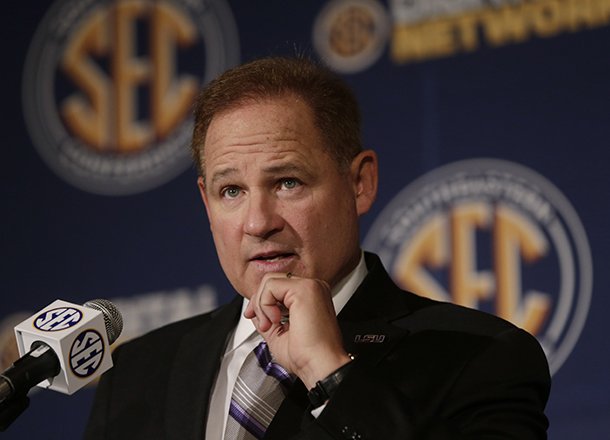 LSU coach Les Miles talks with reporters during the Southeastern Conference football Media Days in Hoover, Ala., Thursday, July 18, 2013. (AP Photo/Dave Martin)