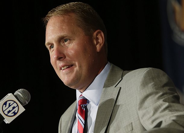 Mississippi coach Hugh Freeze talks with reporters during the Southeastern Conference football Media Days in Hoover, Ala., Tuesday, July 16, 2013. (AP Photo/Dave Martin)