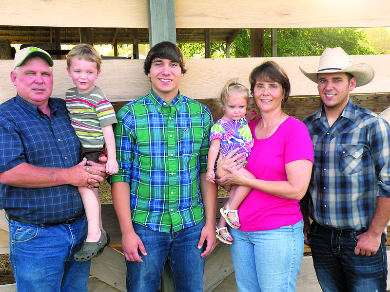 The Dale Davis family of Pleasant Grove has been named the 2013 Stone County Farm Family of the Year. Family members include Dale Davis, left, and his wife, Cheryl, holding their grandchildren, Jonah Magness, 3, and Allison Magness, 18 months, and their sons, Michael Dale Davis, 16, second from the left, and Mark Allen Davis, 21. Not shown is the Davises’ daughter, Megan Michelle Davis Magness, of San Angelo, Texas.