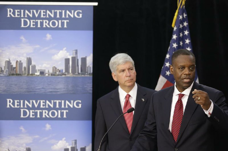 Kevyn Orr (right), Detroit’s emergency manager, and Michigan Gov. Rick Snyder discuss Detroit’s bankruptcy ÿling Friday, saying the historic action gives the city “breathing room” and asking for patience and cooperation for what is expected to be a long process. They stressed that the city would continue to function, with some services actually improving.