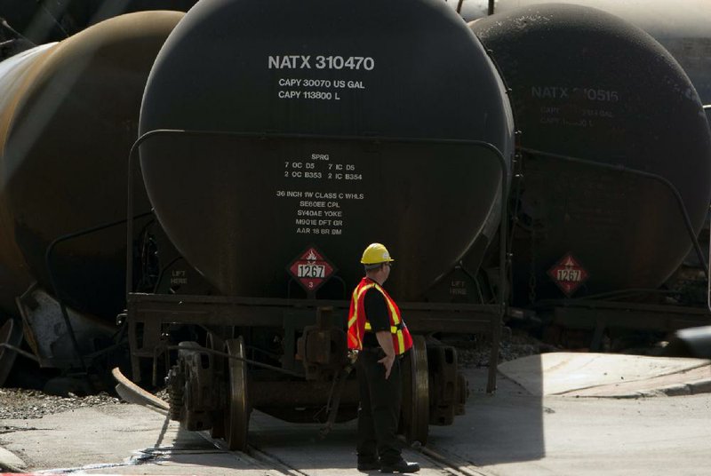 A few of the 72 oil tanker cars that derailed in Lac-Megantic, Quebec, block the line earlier this month. Drillers are producing oil faster than new pipelines can be built, making railroads the best way to move crude from the continent’s midsection to refineries. 