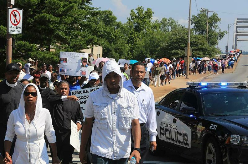 Arkansas Democrat-Gazette/RICK MCFARLAND --07/20/13--  The AME churches of Arkansas lead the March and Vigil for Justice for Trayvon Martin down Broadway St. in Little Rock Saturday. The march started at the base of the Broadway Bridge in North Little Rock and ended with a rally at the Federal Courthouse in Little Rock. 