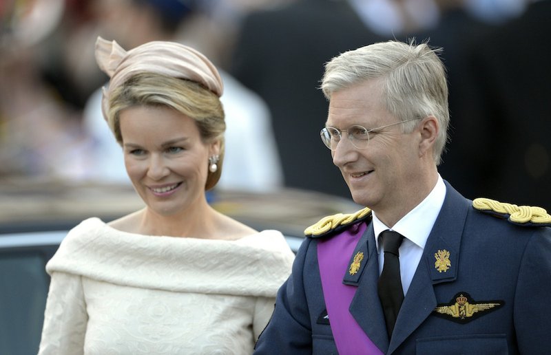 Belgium's Prince Philippe, right, and his wife Princess Mathilde smile as they leave a church service at the St. Gudule cathedral in Brussels on Sunday, July 21, 2013. Belgium's King Albert II was set Sunday to relinquish the throne in a concession to his age and health, paving the way for his eldest son to become the country's seventh monarch.