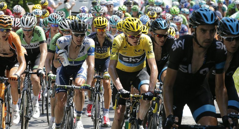 Christopher Froome of Britain, wearing the overall leader's yellow jersey, rides in the pack during the 20th stage of the Tour de France cycling race over 125 kilometers (78.1 miles) with start in in Annecy and finish in Annecy-Semnoz, France, Saturday July 20 2013.