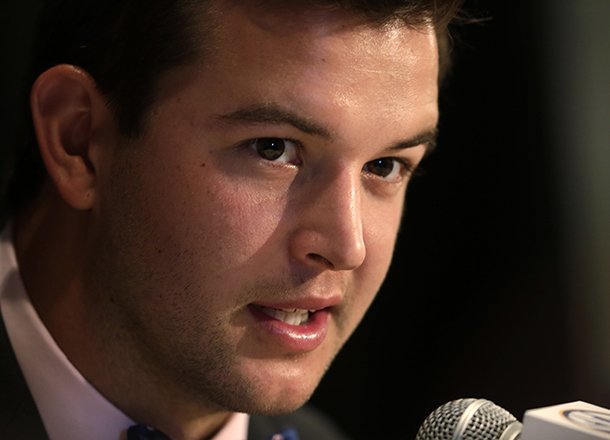 Alabama quarterback AJ McCarron talks with reporters during the Southeastern Conference football Media Days in Hoover, Ala., Thursday, July 18, 2013. (AP Photo/Dave Martin)