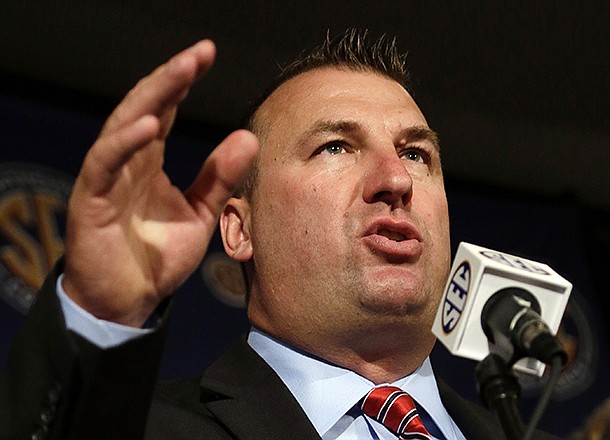 Arkansas coach Bret Bielema talks with reporters during the Southeastern Conference football Media Days in Hoover, Ala., Wednesday, July 17, 2013. (AP Photo/Dave Martin)