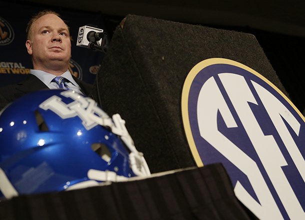 Kentucky coach Mark Stoops talks with reporters during the Southeastern Conference football Media Days in Hoover, Ala., Wednesday, July 17, 2013. (AP Photo/Dave Martin)