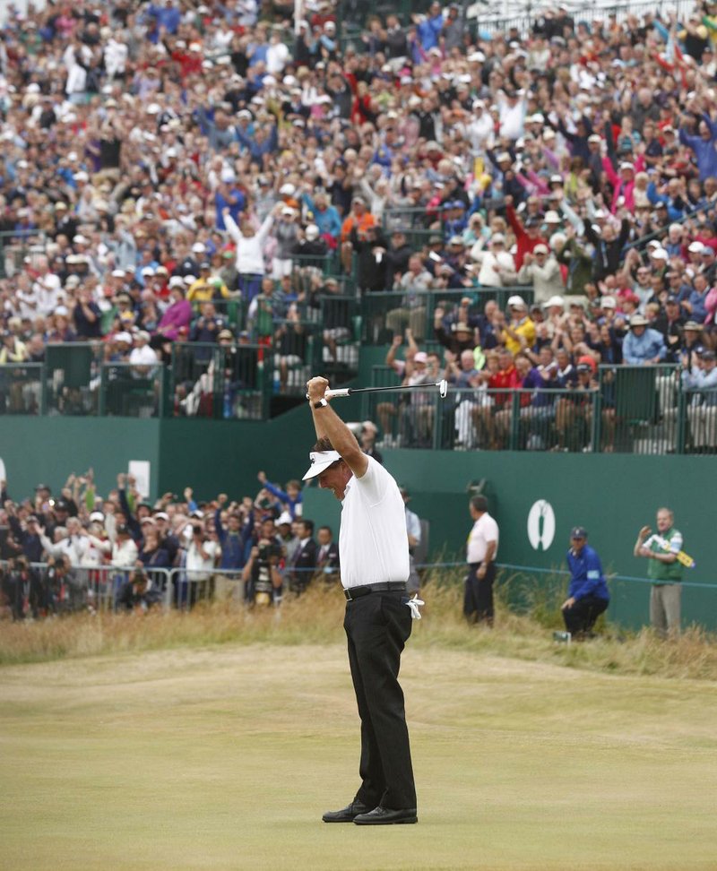 Phil Mickelson of the United States celebrates after his final putt on the 18th green during the final round of the British Open Golf Championship at Muirfield, Scotland, Sunday July 21, 2013. (AP Photo/Jon Super)