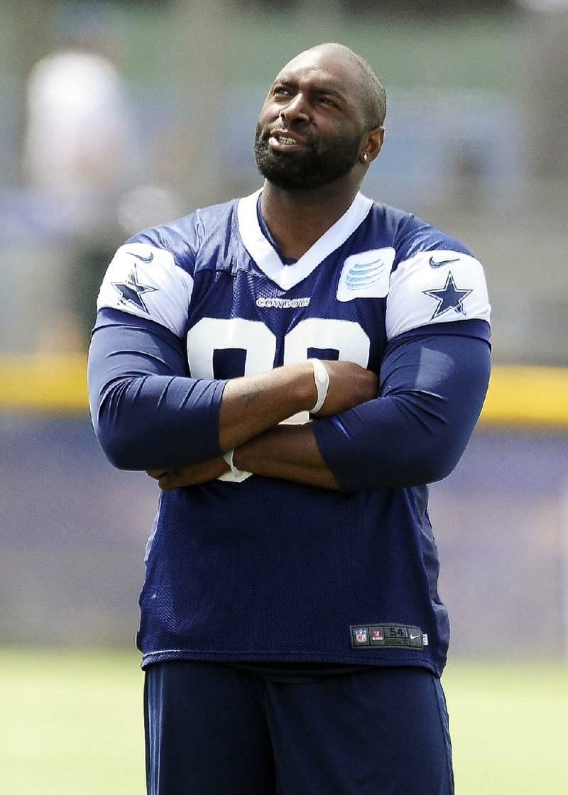 Dallas Cowboys linebacker Anthony Spencer looks on from the sidelines during the Cowboys training camp, Monday, July 22, 2013, in Oxnard, Calif. (AP Photo/Gus Ruelas)