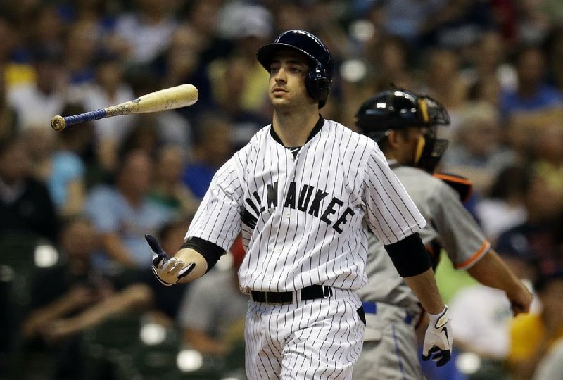 Milwaukee Brewers' Ryan Braun flips his bat after striking out during the third inning of a baseball game against the Miami Marlins Saturday, July 20, 2013, in Milwaukee. (AP Photo/Morry Gash)