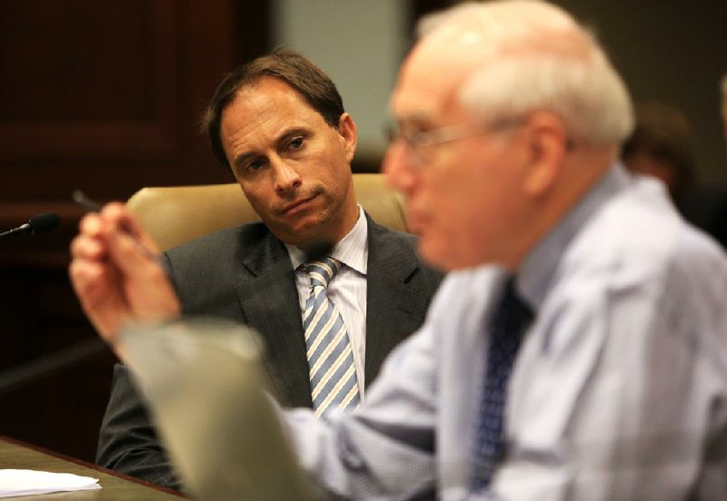 Mike Petrilli (left) of the Fordham Institute listens as Gene Bottoms of the Southern Regional Education Board speaks Tuesday at the state Capitol about the Common Core education standards. 