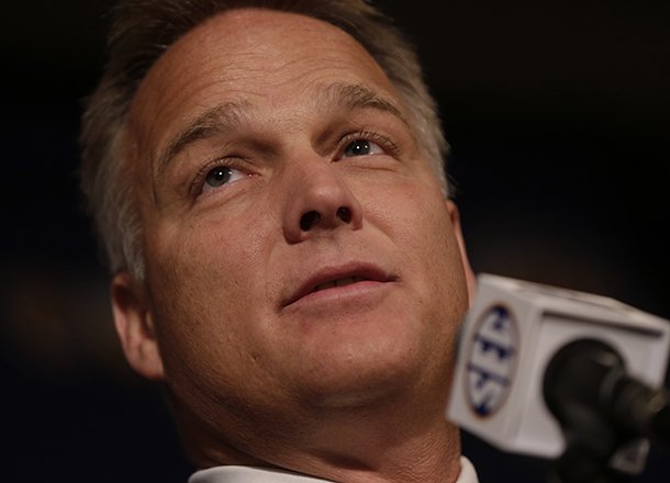 Georgia coach Mark Richt talks with reporters during the Southeastern Conference football Media Days in Hoover, Ala., Thursday, July 18, 2013. (AP Photo/Dave Martin)