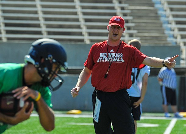 Arkansas State QBs coach Rhett Lashlee shouts instructions during a 2012 fall practice at ASU Stadium in Jonesboro.