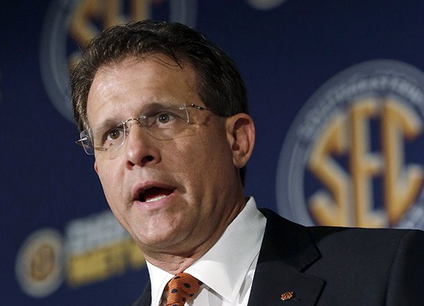 In this July 17, 2013, file photo, Auburn coach Gus Malzahn talks with reporters during the Southeastern Conference football media days in Hoover, Ala. (AP Photo/Dave Martin)