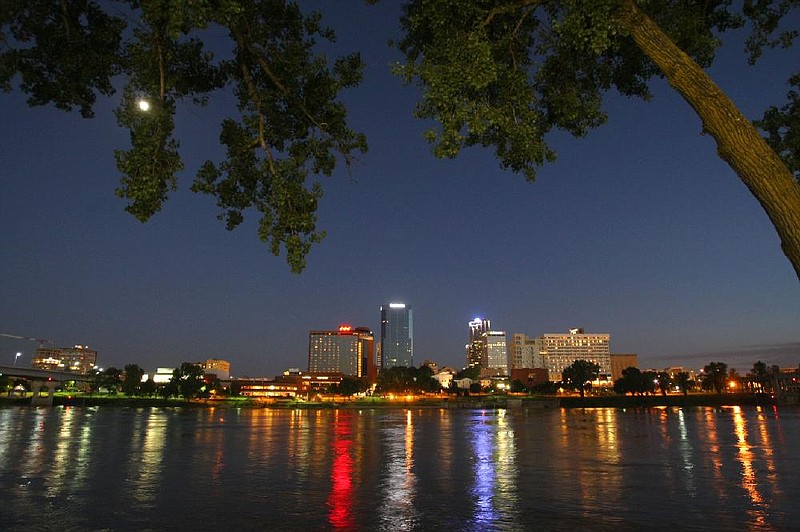 FILE - Little Rock's downtown skyline is reflected in the Arkansas River in this 2008 file photo. (Arkansas Democrat-Gazette/Stephen B. Thornton)