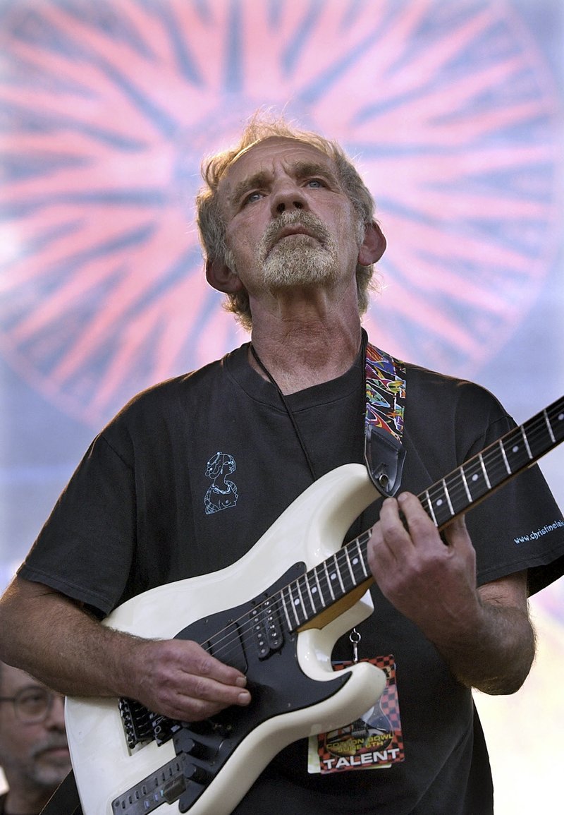 FILE - In this June 5, 2004 file photo, singer-songwriter J.J. Cale plays during the Eric Clapton Crossroads Guitar Festival in Dallas, Texas. Cale, whose best-known songs became hits for Eric Clapton with "After Midnight" and Lynyrd Skynyrd with "Call Me the Breeze," has died. He was 74. Cale’s manager Mike Kappus said the architect of the Tulsa Sound died Friday, July 26, 2013 of a heart attack at Scripps Hospital in La Jolla, Calif. 