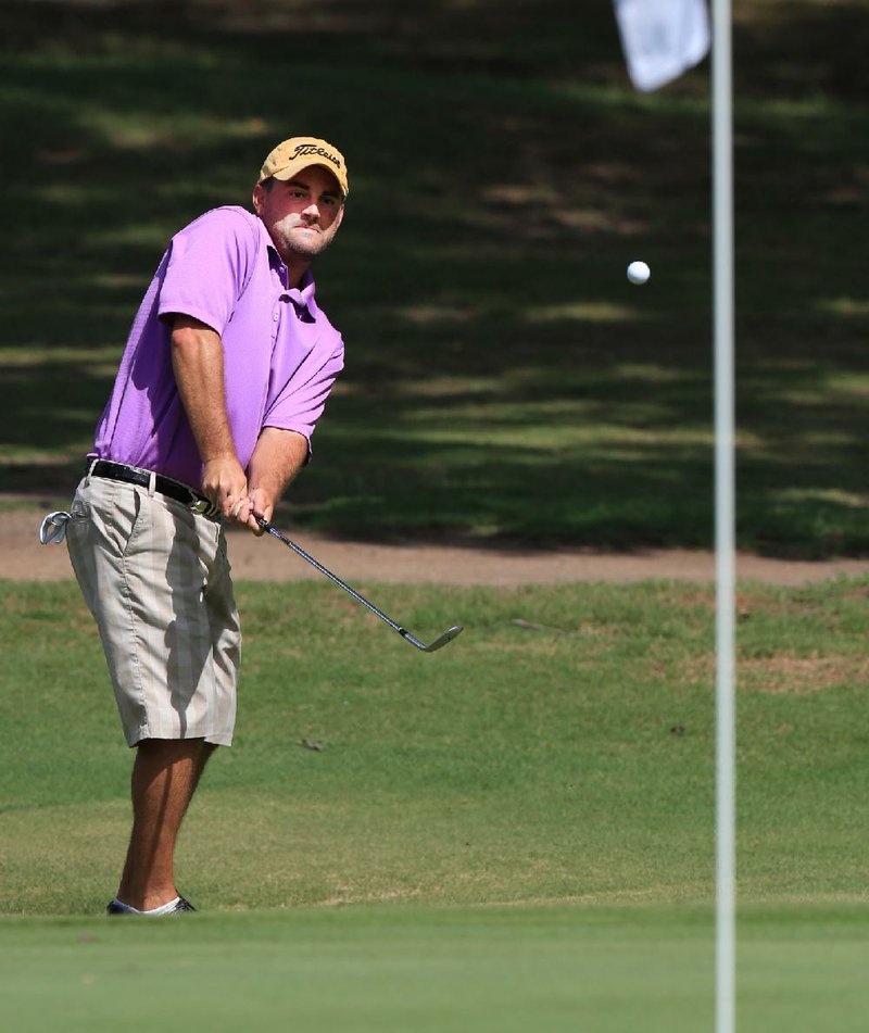 Arkansas Democrat-Gazette/RICK MCFARLAND --07/27/13-- Brad Lynch, of Farmington, chips onto the green on the par 4, no: 1 hole at Maumelle Country Club during the Maumelle Classic Saturday.