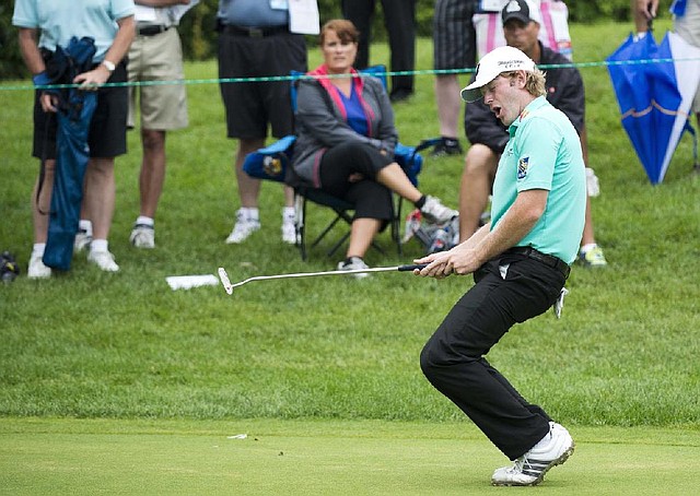 Brandt Snedeker reacts after missing a birdie putt on the 17th green during the third round of the Canadian Open golf tournament at Glen Abbey in Oakville, Ontario, Saturday, July 27, 2013. (AP Photo/The Canadian Press, Nathan Denette)
