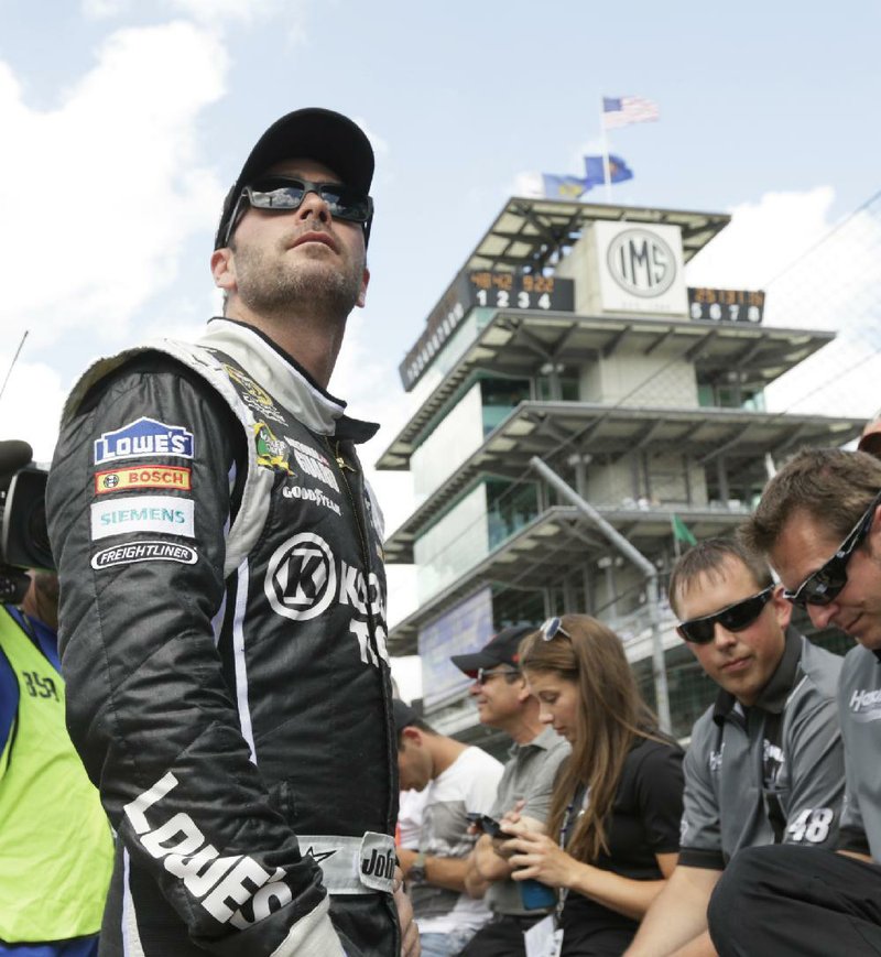 Sprint Cup Series driver Jimmie Johnson watches during qualifications for the Brickyard 400 auto race at the Indianapolis Motor Speedway in Indianapolis, Saturday, July 27, 2013. (AP Photo/AJ Mast)